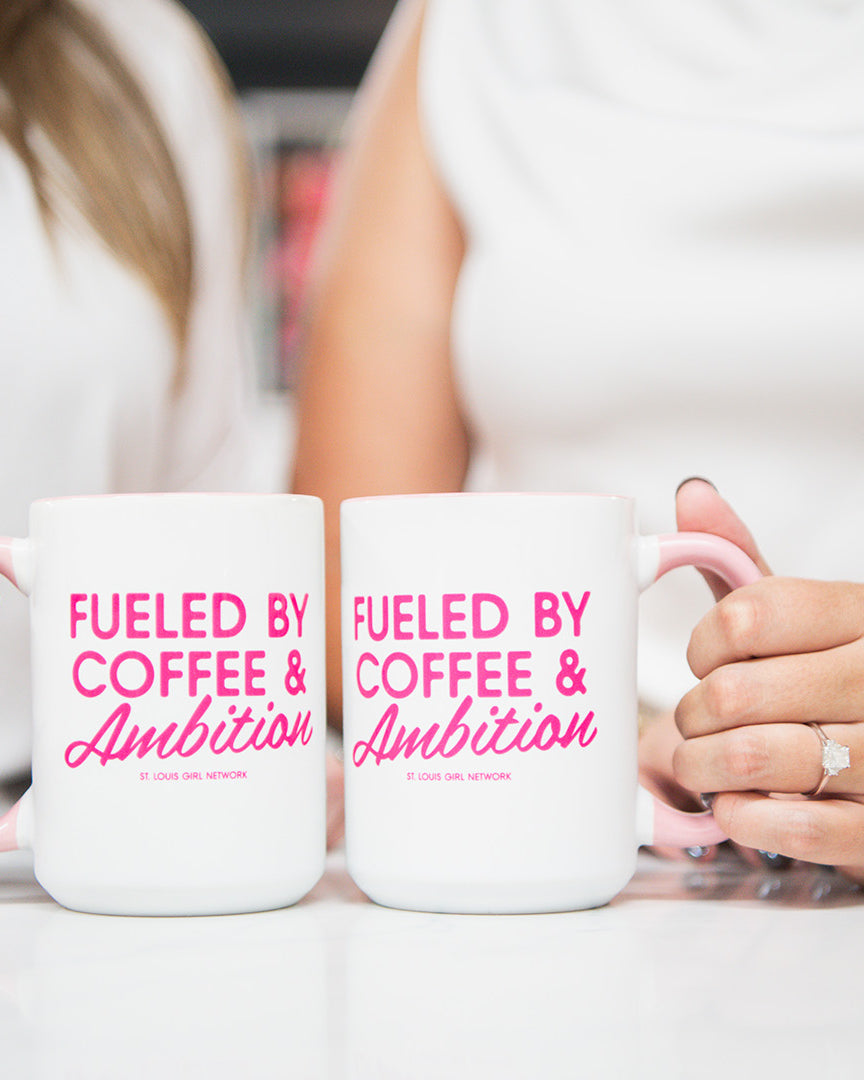 Two people holding mugs with 'Fueled by Coffee & Ambition' text.