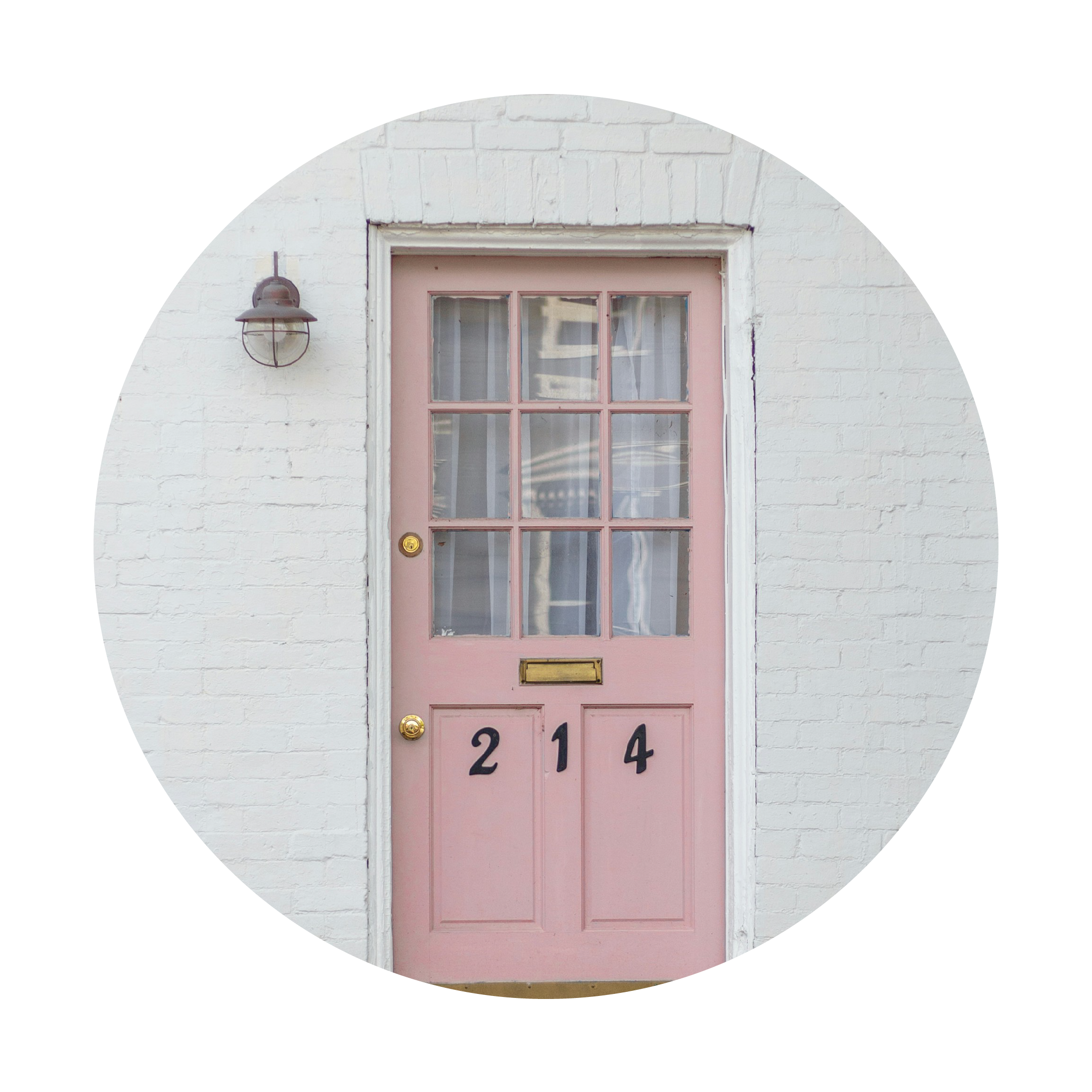 Pink door with gold handle and number '214' on a white brick wall.