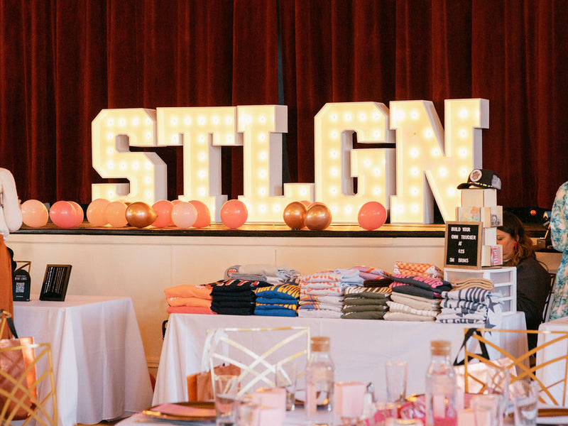 STLGN Marquee Letters on a stage with balloons